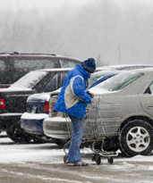 man_snowy_parkinglot